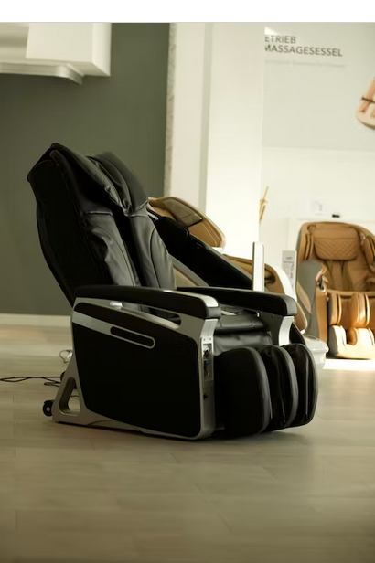 a black deluxe massage chair in a store